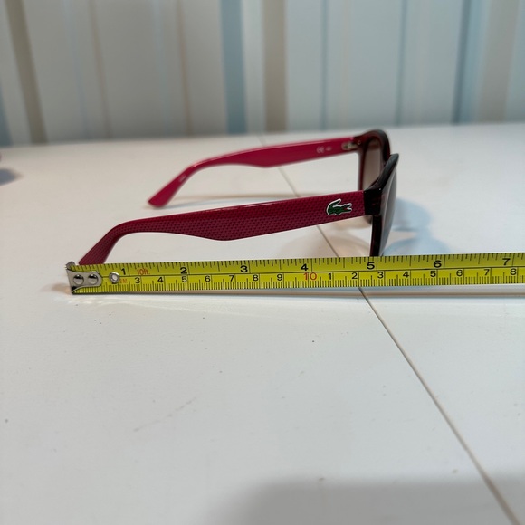 Pink women’s Lacoste sunglasses with pink striped carrying pouch main image 7